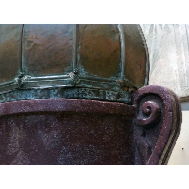 notice here the decorations on the bottom of the metal cover: arrises, mouldings, angels; also floral and/or foliate decorations between the incised initials