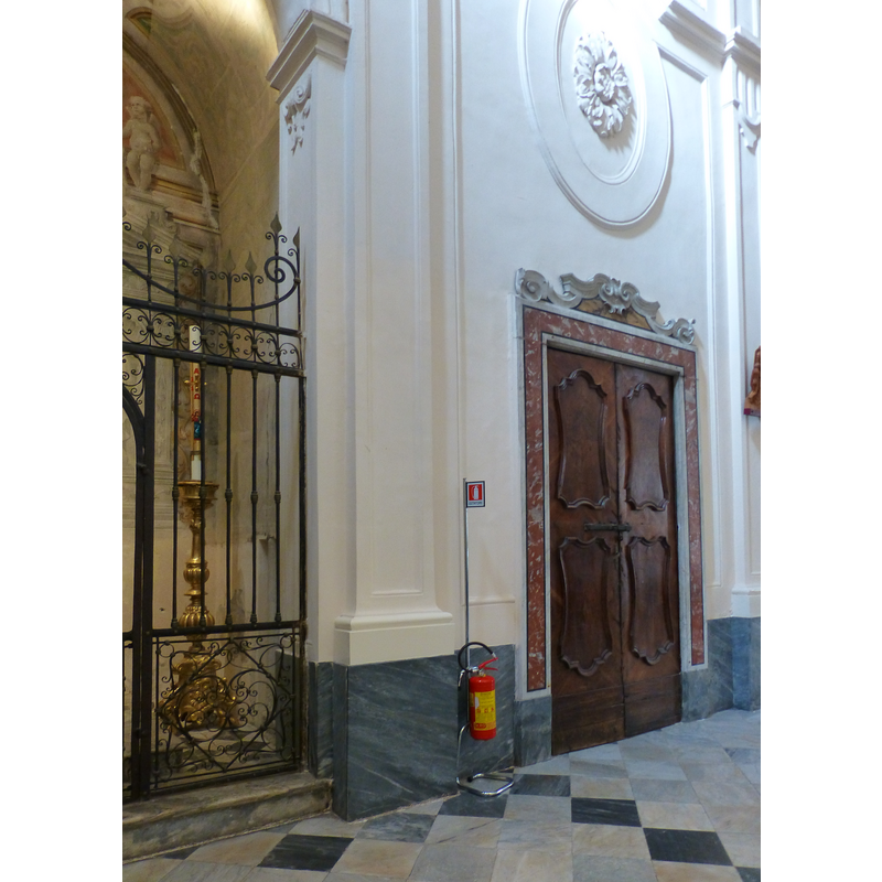 the candelabrum in the left of the image is inside the baptismal chapel