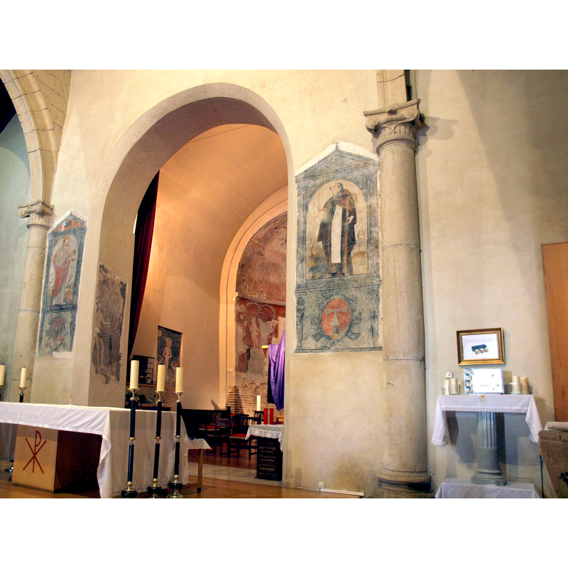 seen from the nave; the large apse painting is partially visible through the opening