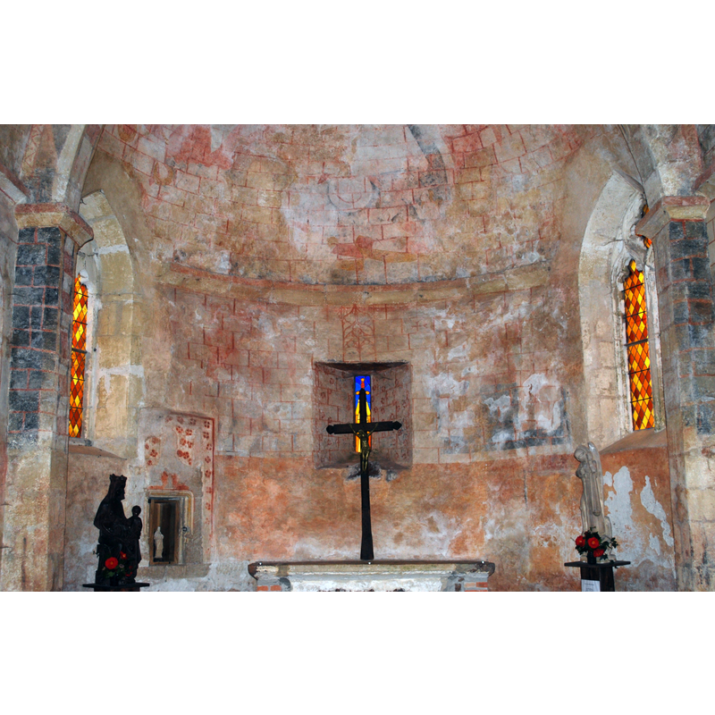 showing some of the late-medieval frescoes on the wall of the apse