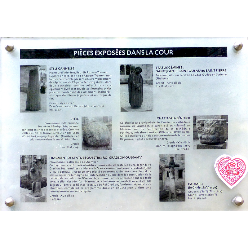 museum plaque detailing the objects displayed in the courtyard