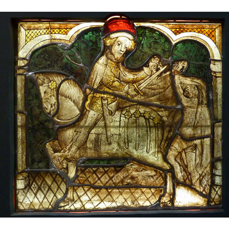 Source caption: "Bleiglasfenster im Musée National du Moyen Âge (Hôtel de Cluny) in Paris; Herkunft: Betton (Bretagne), 1425-1430; Darstellung: hl. Martin teilt seinen Mantel mit einem Bettler".