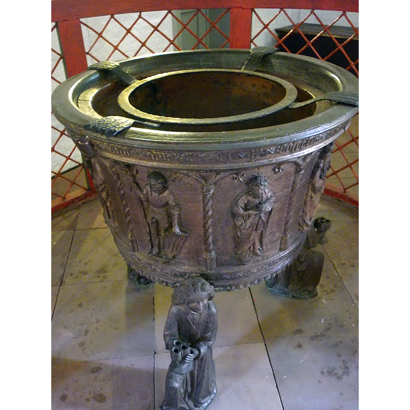 appears to be part or behind the arch-heads