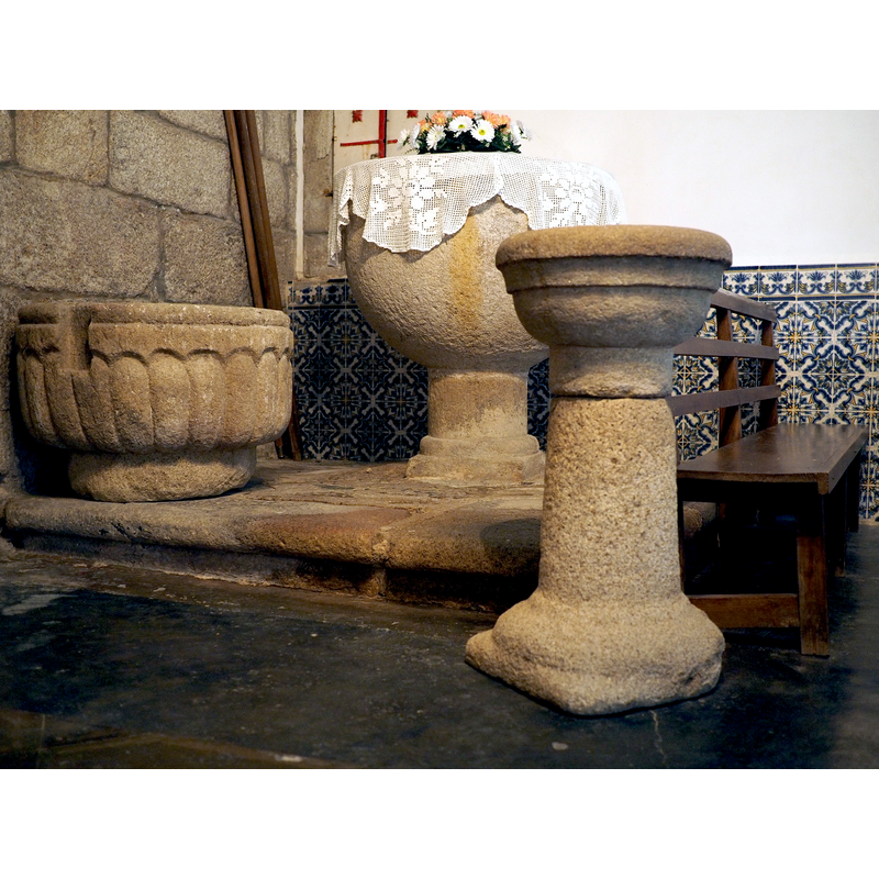 seen here in the background, with the older font (left) and the stoup (right)