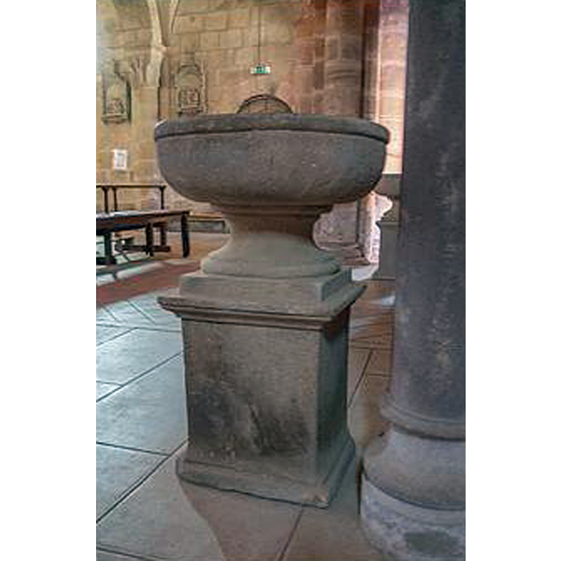 two stoups located at the west end of the nave, one at each side of the entranceway