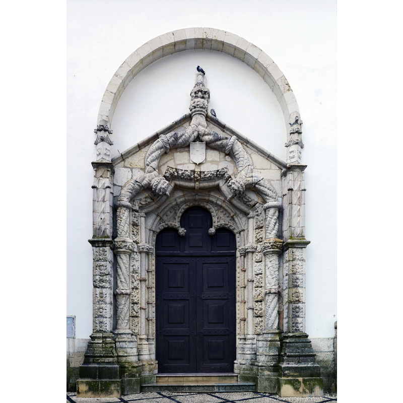 Source caption: "Manueline portal of the church of São Julião, Setúbal, Portugal".