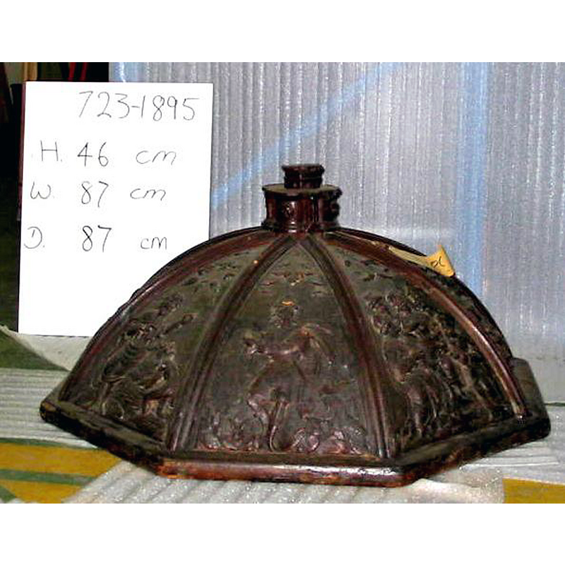 on the board behind the cover are the museum code and the dimensions of the object