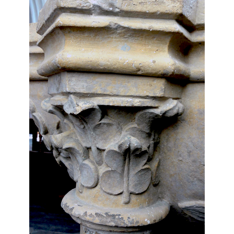 one each atop the three side colonnettes; moulded and decorated with floral and foliage motifs