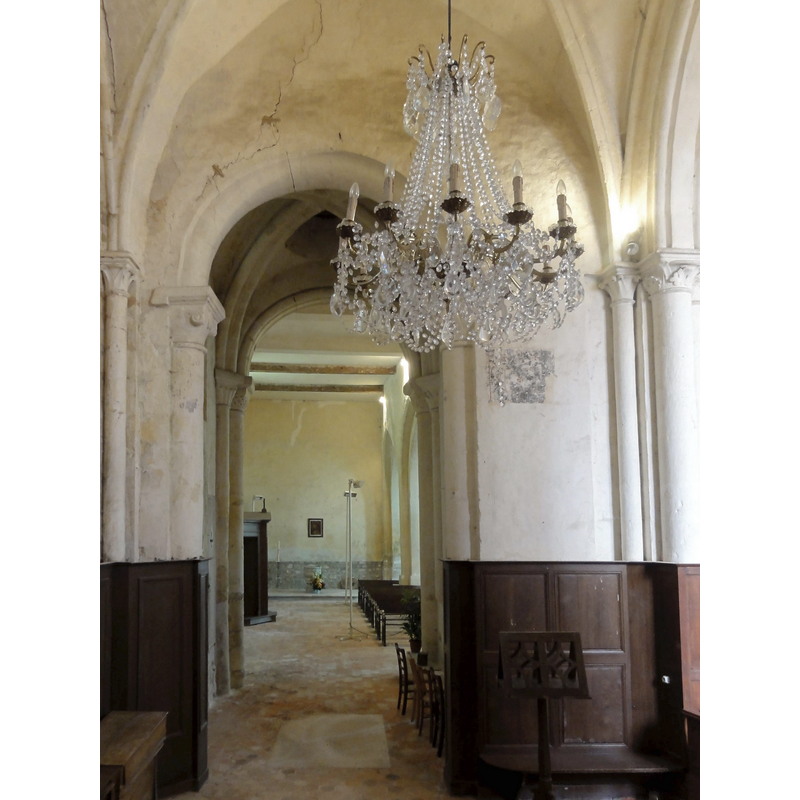 with the font and cover at the far [west] end -- Source caption: "Courcelles-sur-Viosne (95), église Saint-Lucien, chœur sud, 2e travée, vue vers l'ouest"