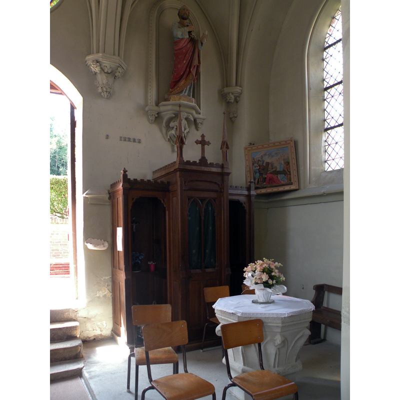 the font and the confessional to the north of the west entranceway