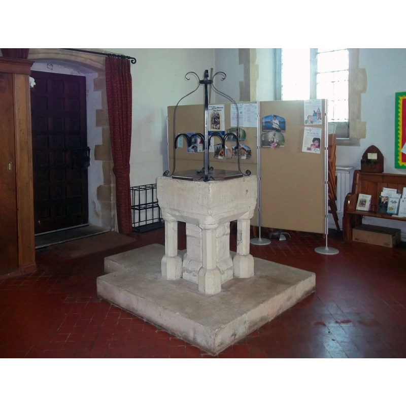 the tall metal ornament fits atop the upper tim of the basin and its flat wooden cover