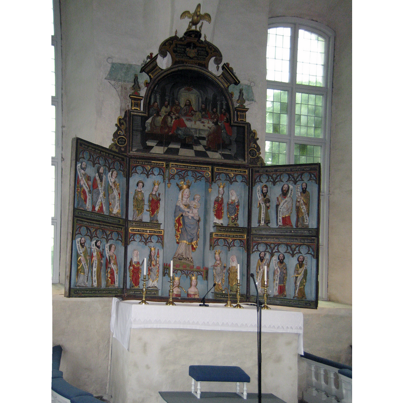 "During the 15th century some new wooden sculptures were acquired, above all an altarpiece from Northern Poland. It is a very large triptych with the Madonna surrounded by the four crowned virgins and four other female saints in the margins. On the side wings are the apostles representing the Credo series. Other more modest sculptures represent Saint George and the Dragon and Saint Barbara." [source: Åsa Ringbom 2012  [www.kyrkor.ax/churches/sund-church/] [accessed 26 July 2017]]