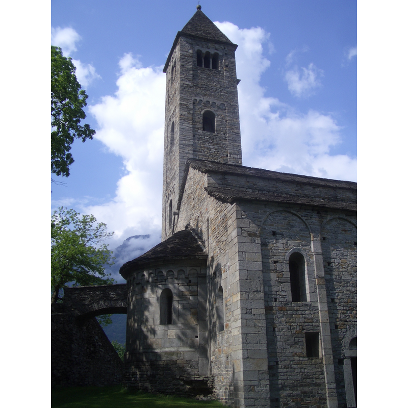 Source caption: "Biasca, St. Peter and Paul church”, apse and clock tower, XII century".