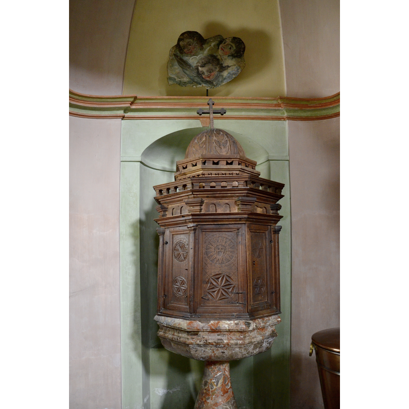 the modern font in this church and its rim-buffet wooden cover