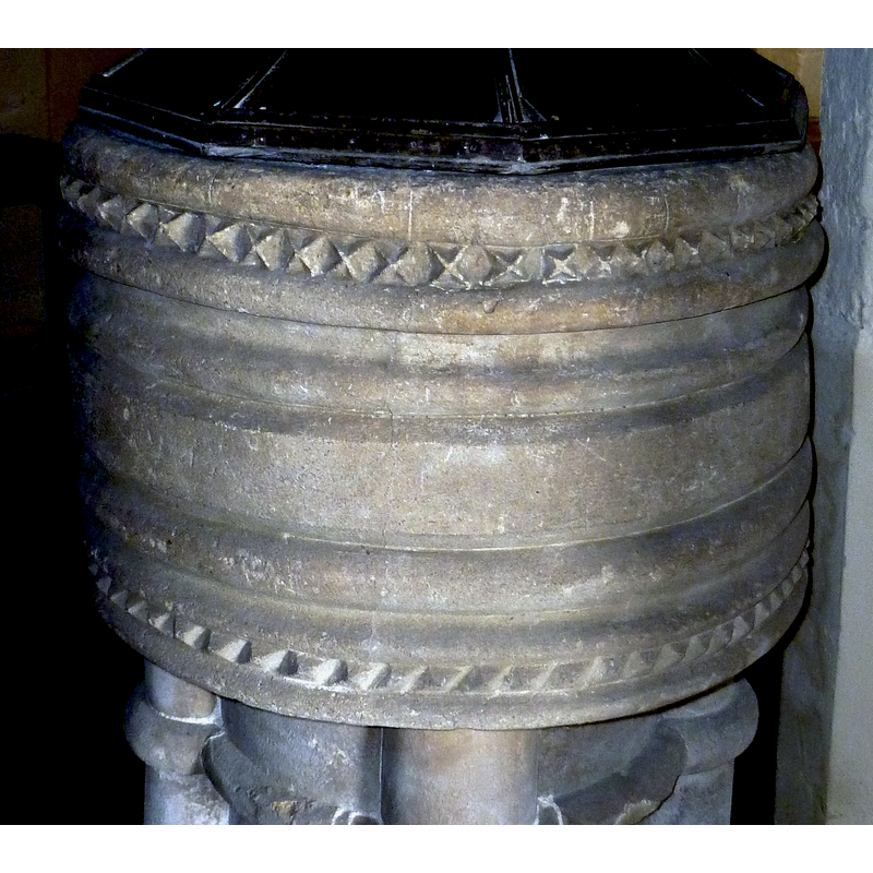 on the lower basin side, between the last two mouldings