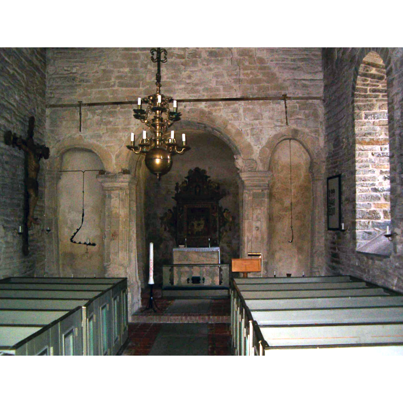 the old font, which cannot be seen in this photograph, is located in the far left [northeast] corner, at the foot of the large crucifix