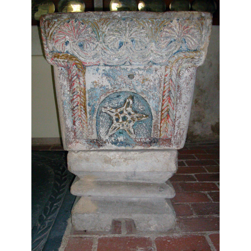 one side of the font has retained much of its paint