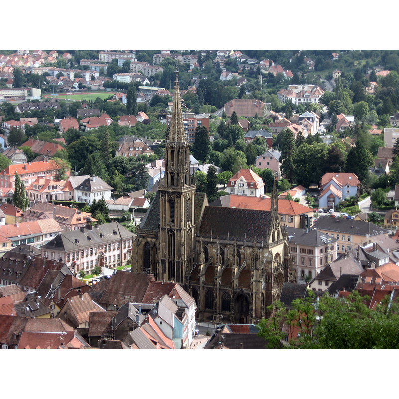 Source caption: "Vue plongeante sur Thann et son église".