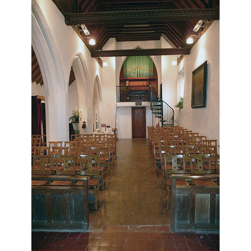 the modern font is partially visible at the far [west] end, left [north] aisle -- Source caption: "Kimpton - St Peter and St Paul's Church. The interior of the church with the repositioned organ which was moved from the South Transept to the tower. The organ dates from 1892 and was moved to its new location in 2004."