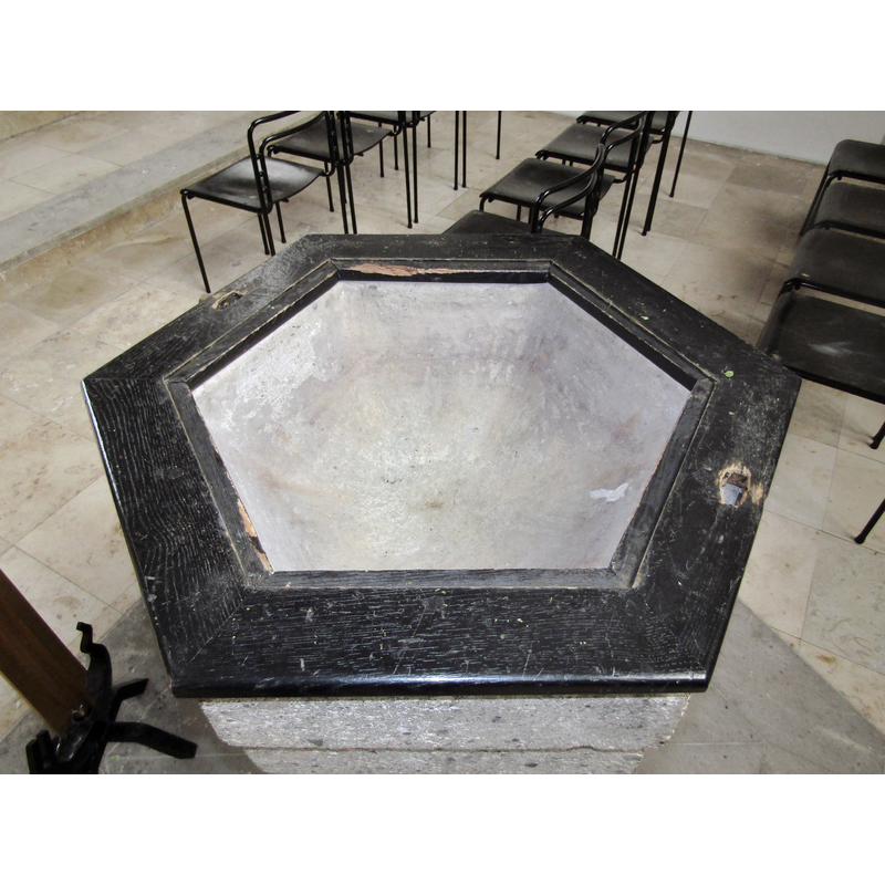 showing the wooden frame for the cover and the basin interior; there are two holes in the frame to give access to the petal staples in the upper rim of the basin