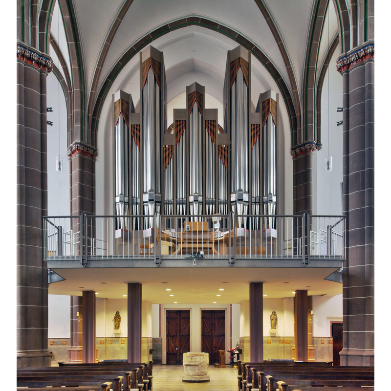 the medieval Bentheim font at the foot of the organ gallery