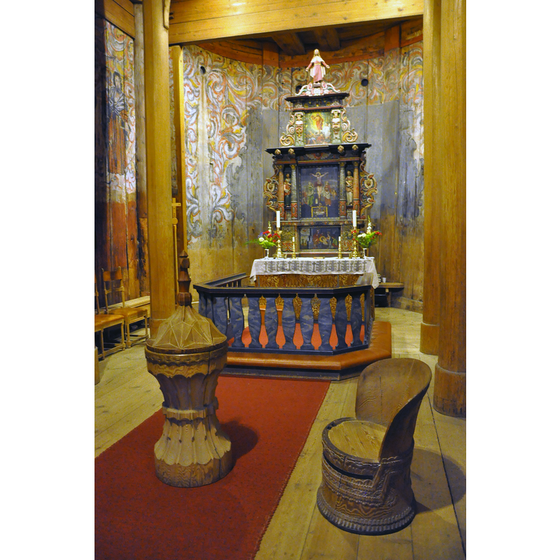 the modern wooden font of ca. 1850 in the chancel of the church