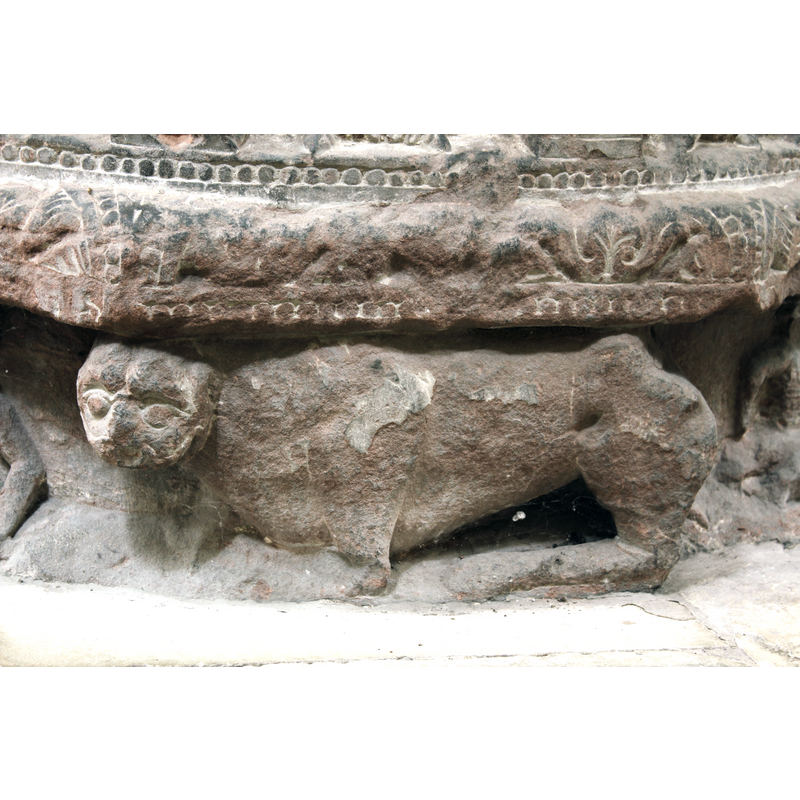 passant to the left, although the posture is almost couchant; the head of this thrid lion is not very feline, resembling rather that of a weasel