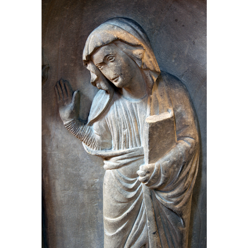 Mary holding a closed book in her left hand