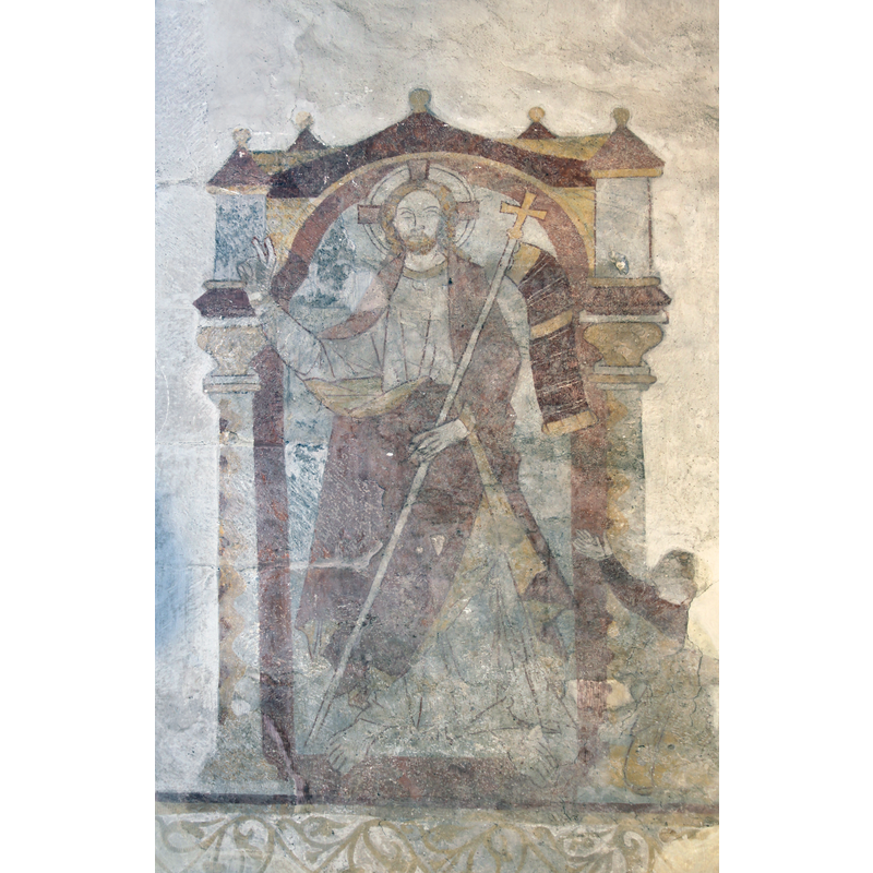 on the east wall, south side of the altar