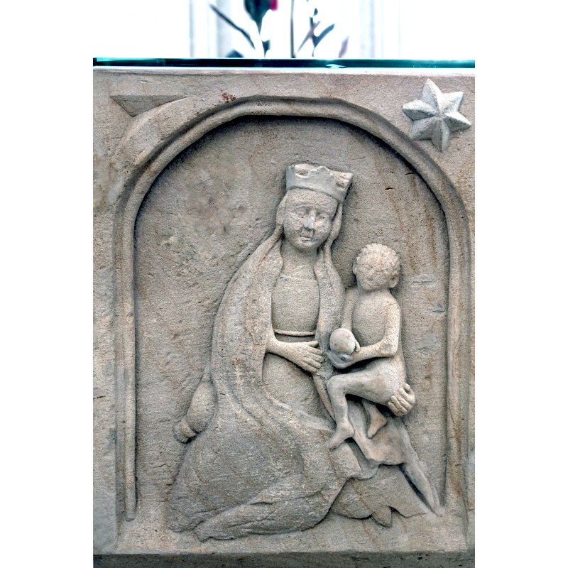 curly-haired Christ-Child naked, holding a round object