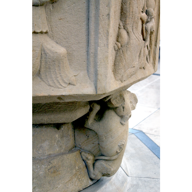 one of four; this one, located below the Madonna and Child scene, is damaged