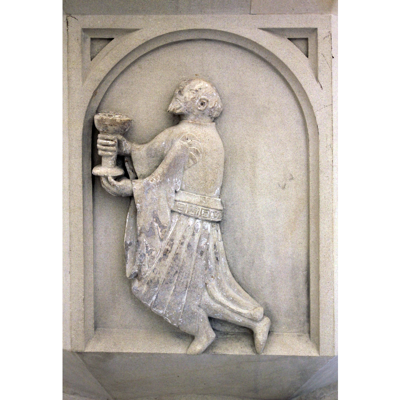 like the first Magi of the Adoration scene on the font at Olfen, this one is also without a crown on his head