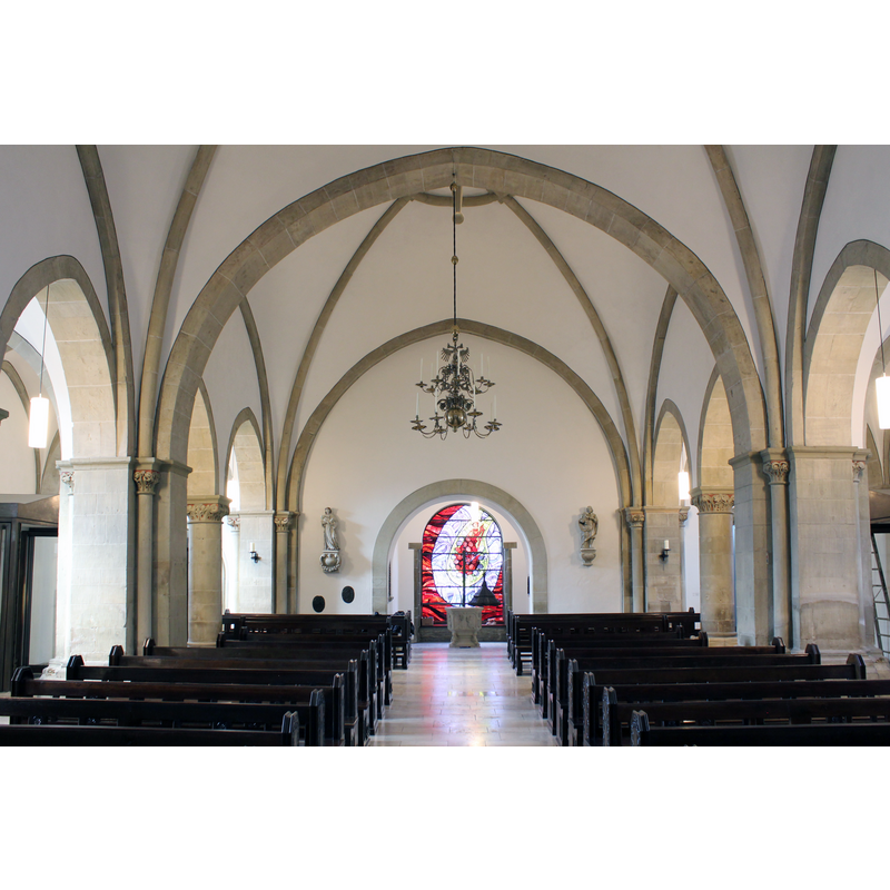 with the font at the far [west] end, beneath the tower