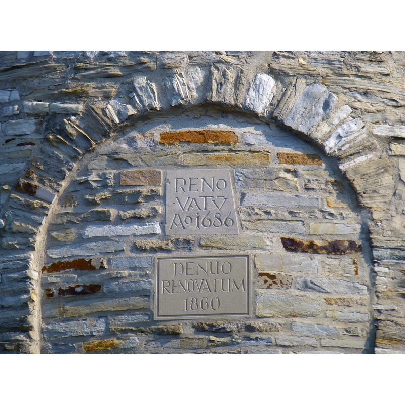 one of the plaques recording the renovation stages of the church