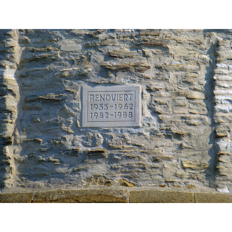 one of the plaques recording the renovation stages of the church