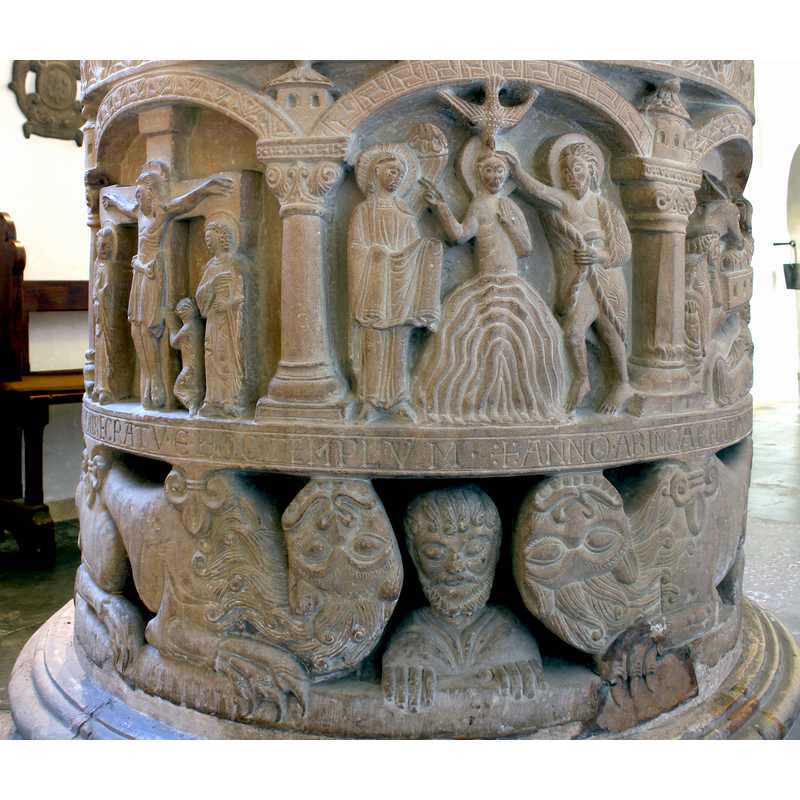 the Crucifixion and the Baptism of Christ in the arcade, the commemorative inscription and Daniel with his lions below