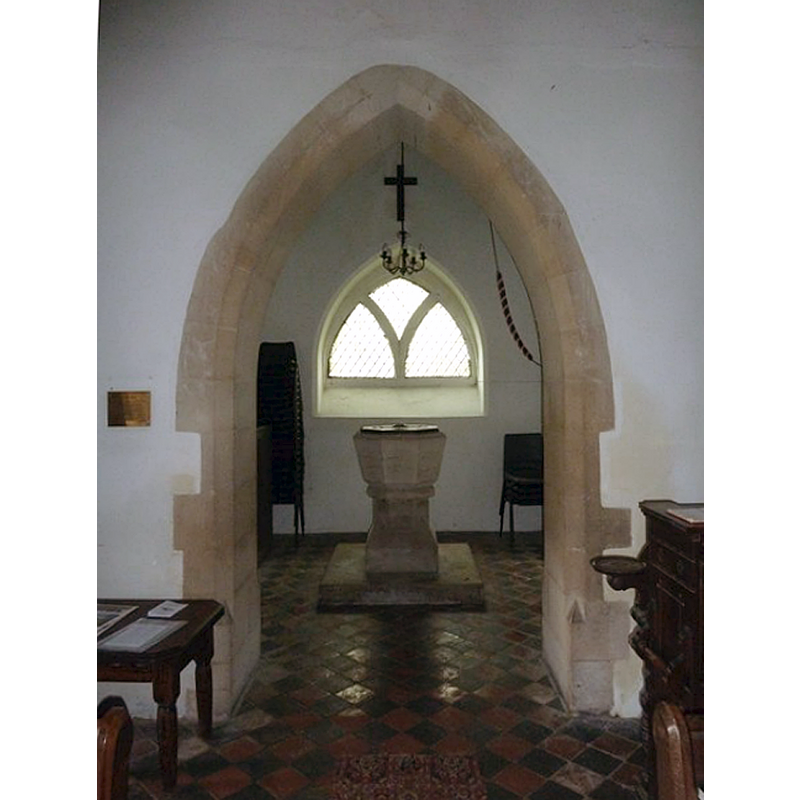 view of the tower arch, and of the modern font and cover beneath the tower