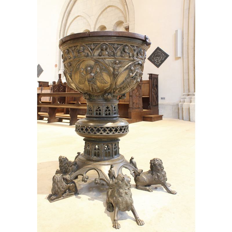 housing the Baptism of Christ scene and the symbols of the four Evangelists