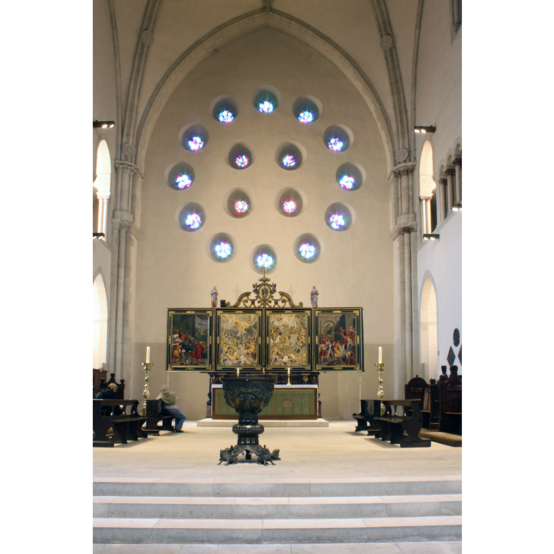 the 'Alte Chor' with its Baroque retable; it is now located at the west end of the church; the baptismal font is just east of it