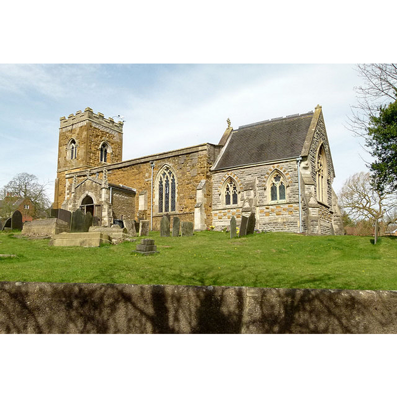 Source caption: "Church of St Luke, Upper Broughton. Seen from the south east from Rectory Drive, highlighting the chancel designed by Teulon in 1855. Although primarily of limestone, it incorporates the local orange ironstone to create a polychrome effect. The Georgian style of the porch arch is also evident"