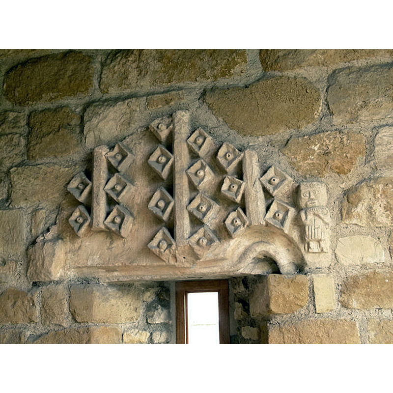 Source caption: "Church of St Luke, Broughton Sulney (Upper Broughton). The early Norman carved stone in the porch, thought to depict St Oswald and the heavens."