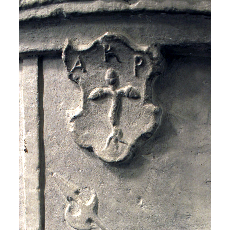 the passant soldier (?) does not appear to be part of either the previos scene (Crucifixion) or the following (St George and the dragon); above and to the left is a charged shield with intials AKP