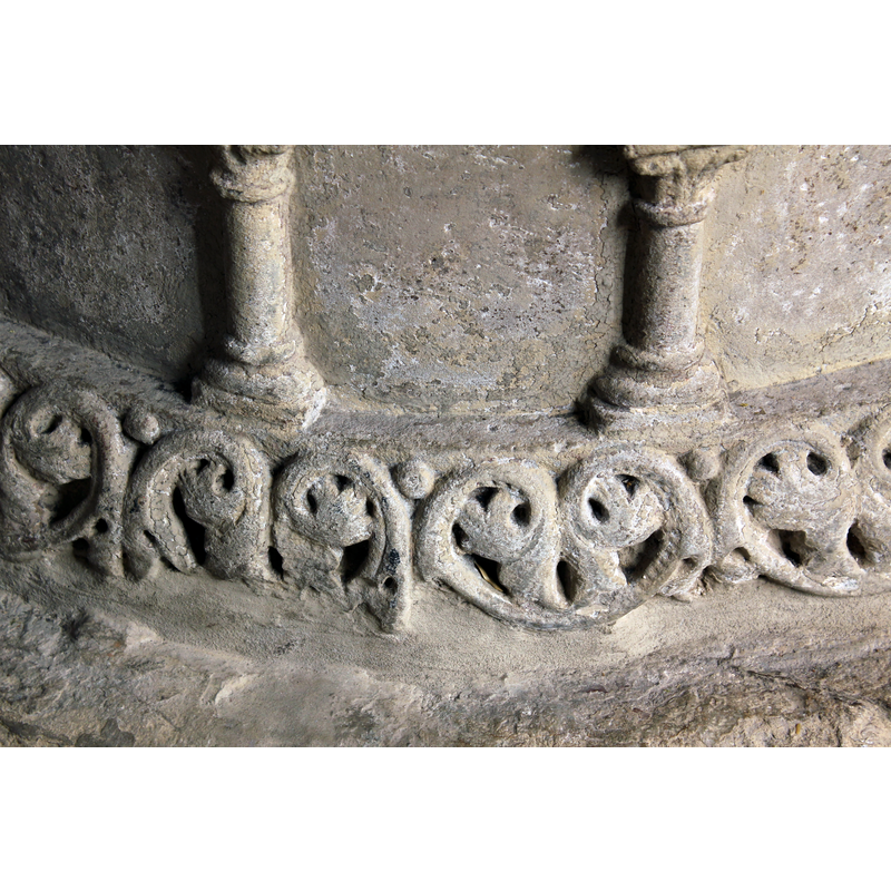 forming a pattern all around, the beads in the upper spandrels or interstices formed by the palmettes