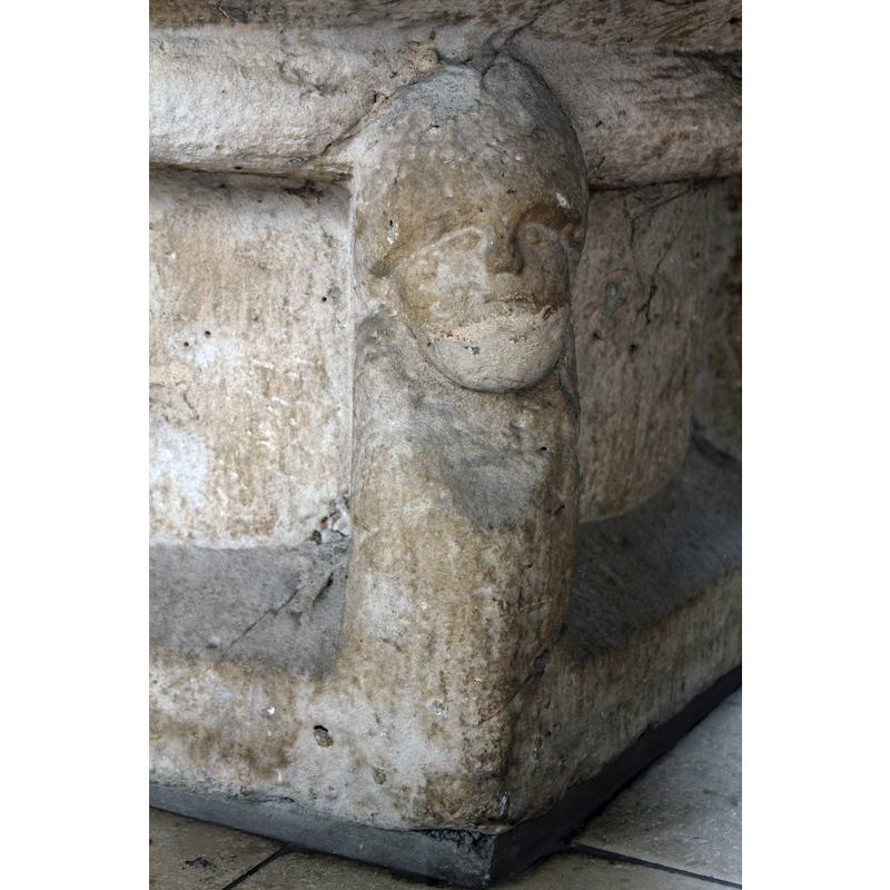 very sketchy but the upper part of the head could be a bishop's mitre