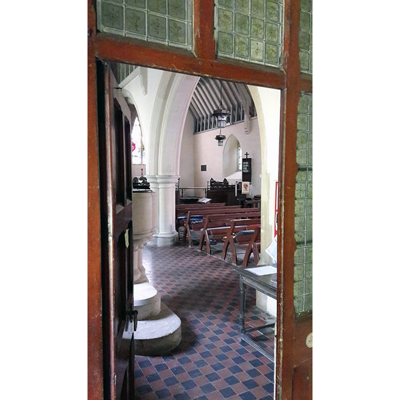 Source caption: "North aisle doorway at St Joh the Evangelist, Little Tew. The porch under the tower now offers two doors into the church since this north aisle was added in 1869."