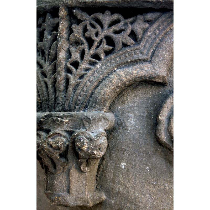 one of the decorated capitals of the unsupported arcade and its spandrel