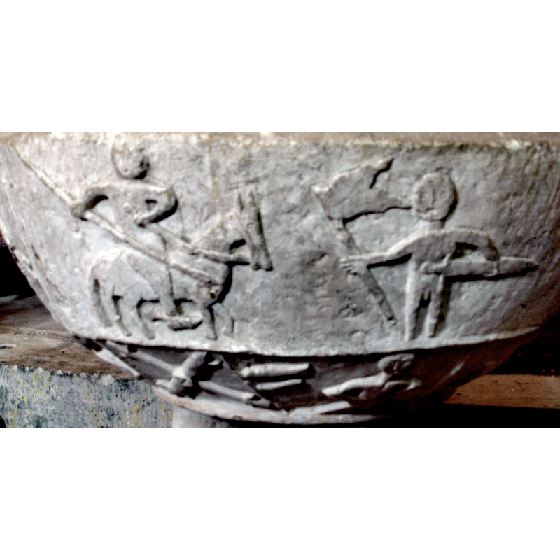 the horse and horseman face right; the horseman points the spear diagonally to the ground