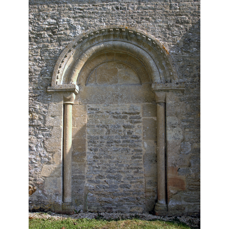 Source caption: "Blocked south doorway of St Peter's parish church, Wilcote, Oxfordshire, viewed from the outside."