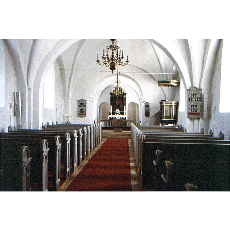 the old granite font is visible at the far [east] end of the aisle, up the chancel steps