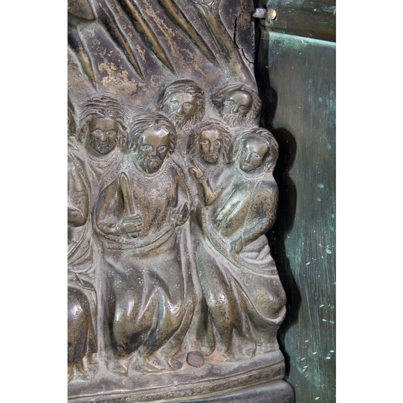 Paul holds a sword; he and Peter are the only Apostles showing their identifuing symbols